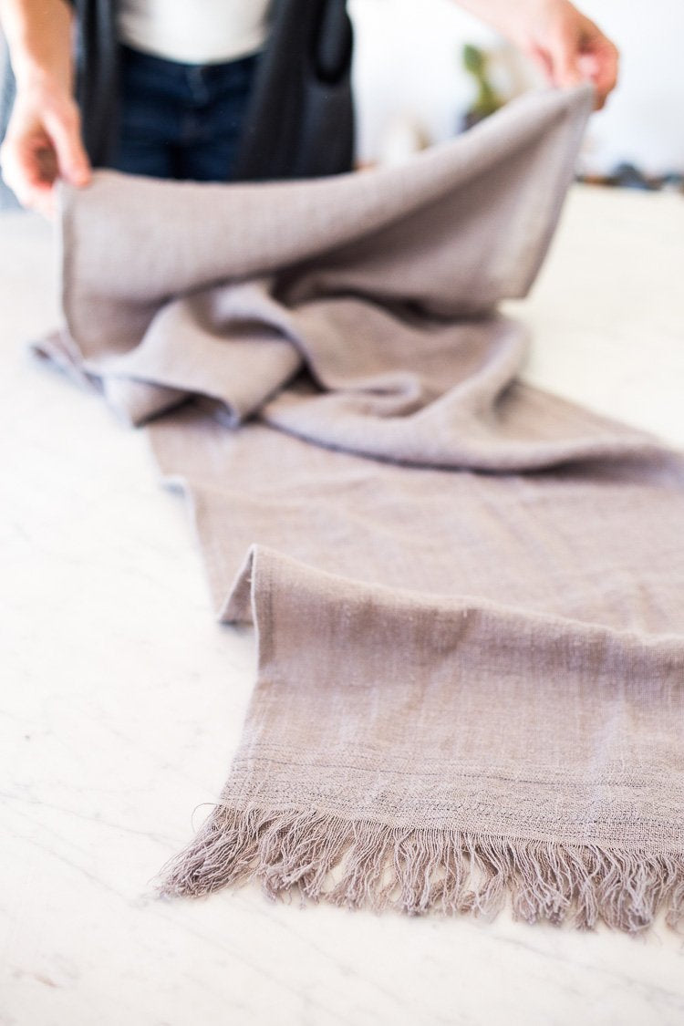 Handmade linen table runner, gray fabric is fringed on the ends. #tablerunner 