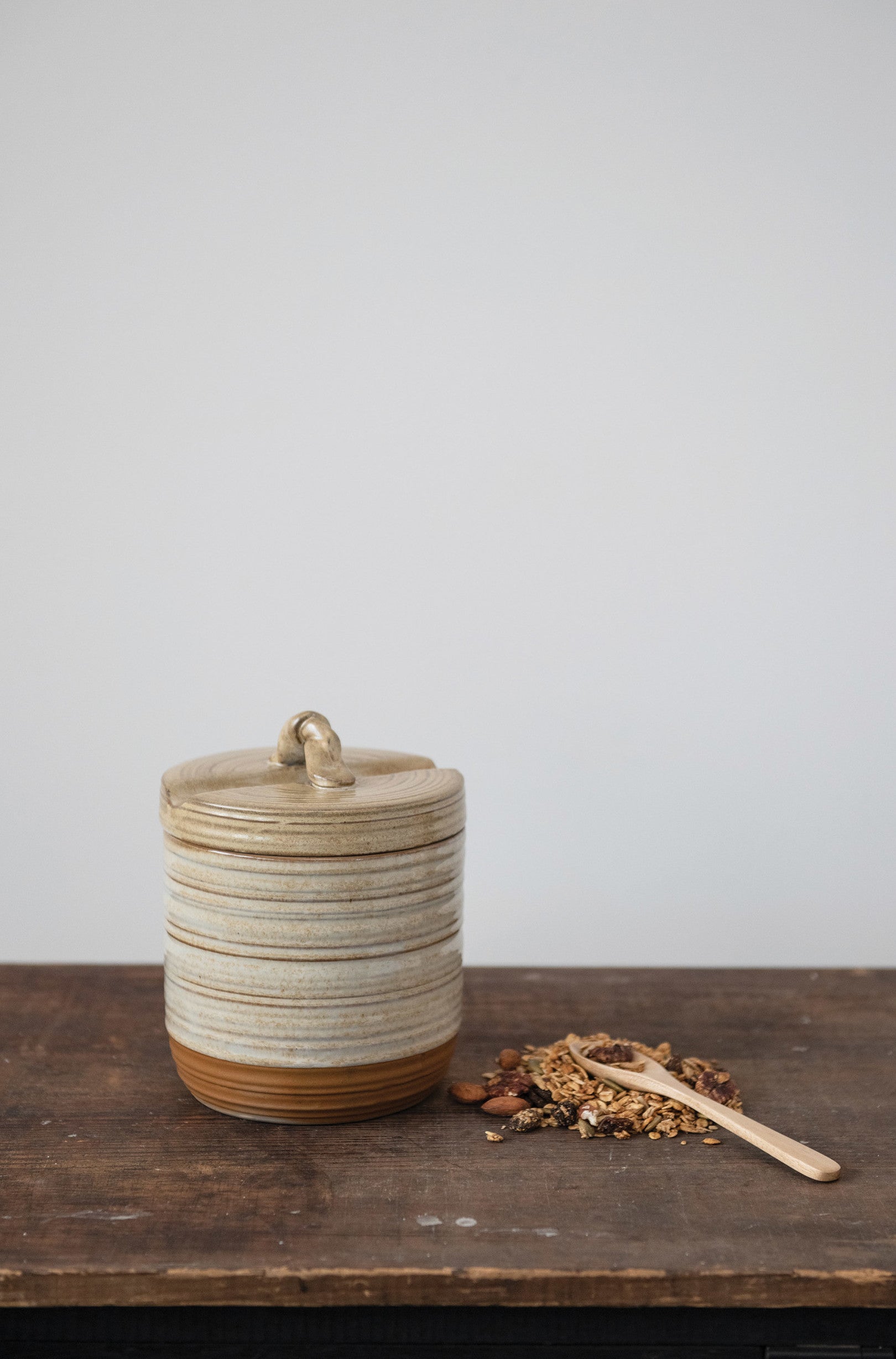 stoneware jar with lid and spoon