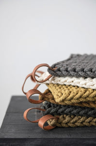 hand crocheted pot holders with leather tie